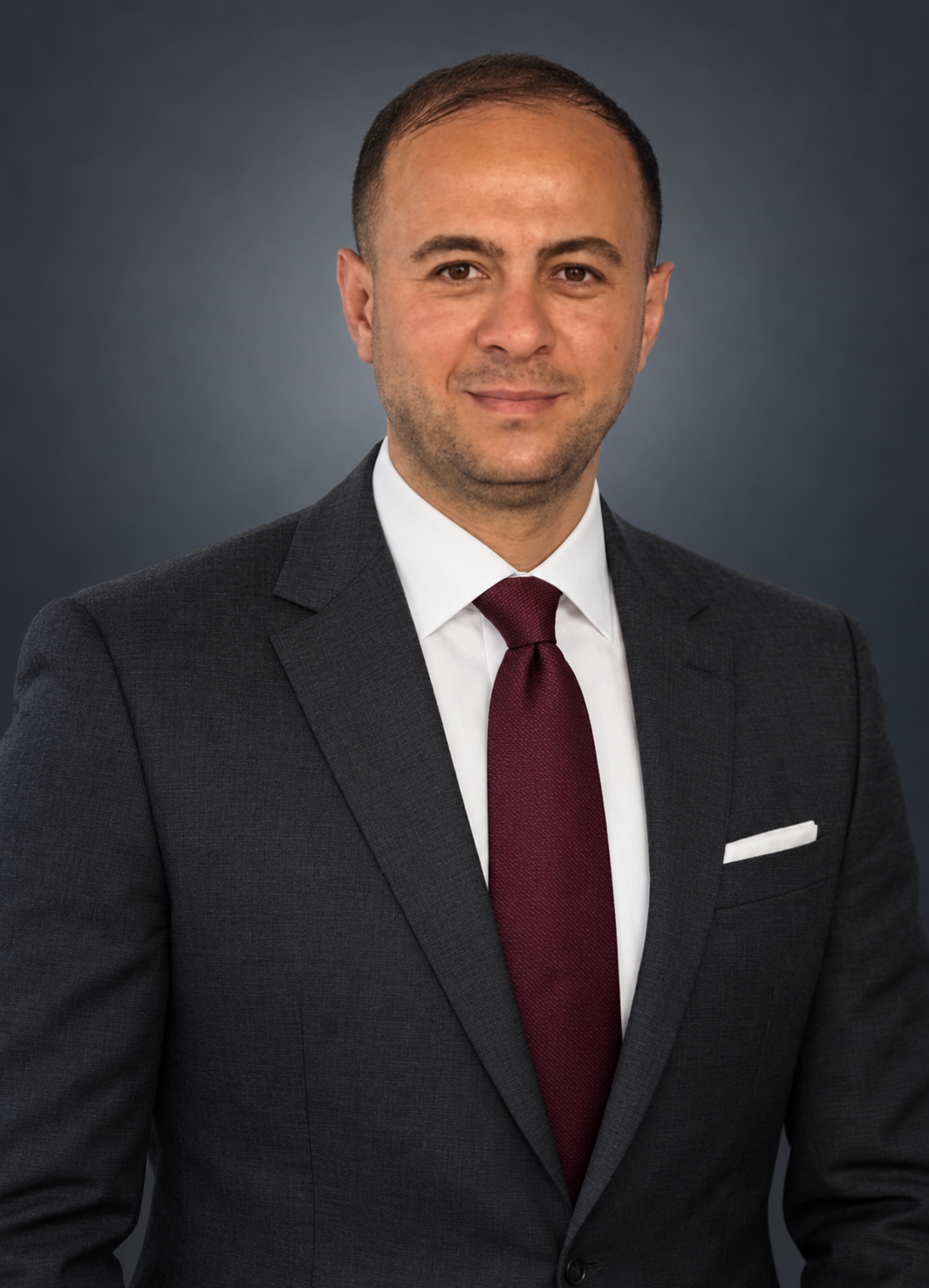 Executive Portrait in Charcoal and Burgundy.png